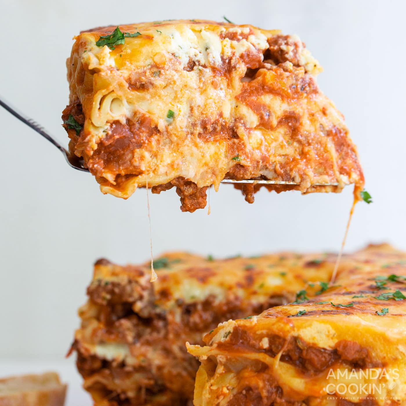 spatula lifting slice of Instant Pot Lasagna