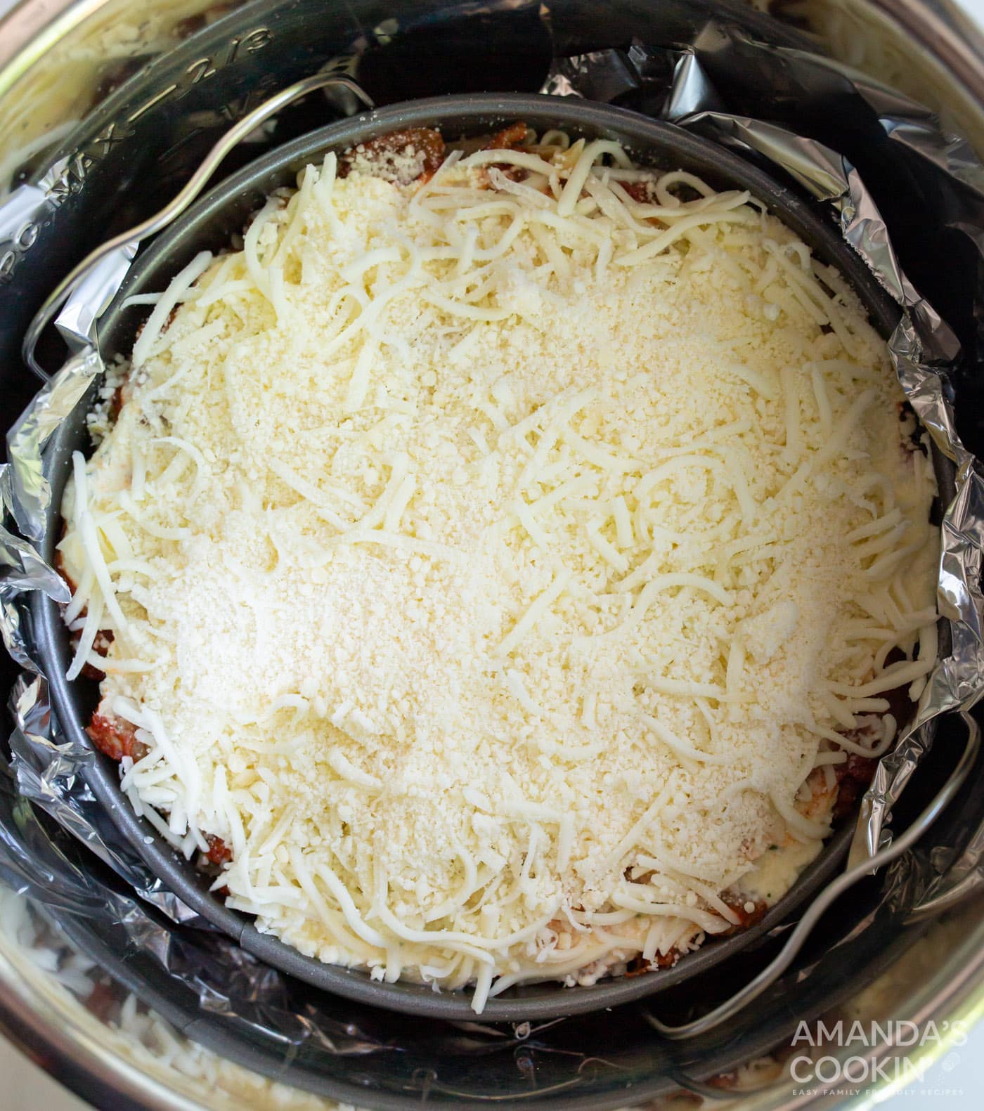 springform pan wrapped in aluminum foil in the instant pot