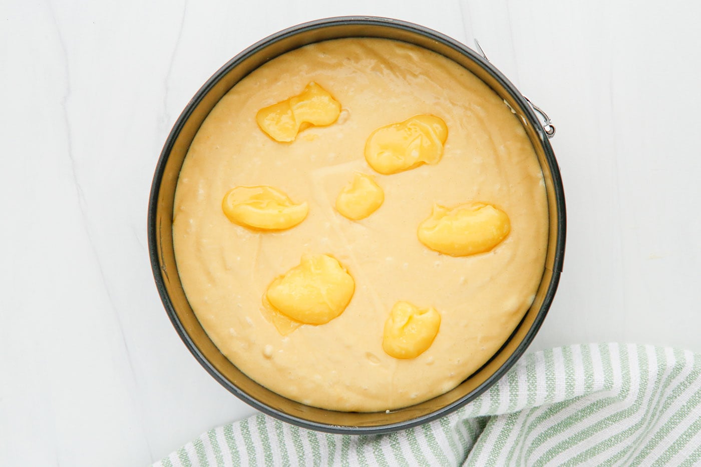 lemon curd on top of cake batter