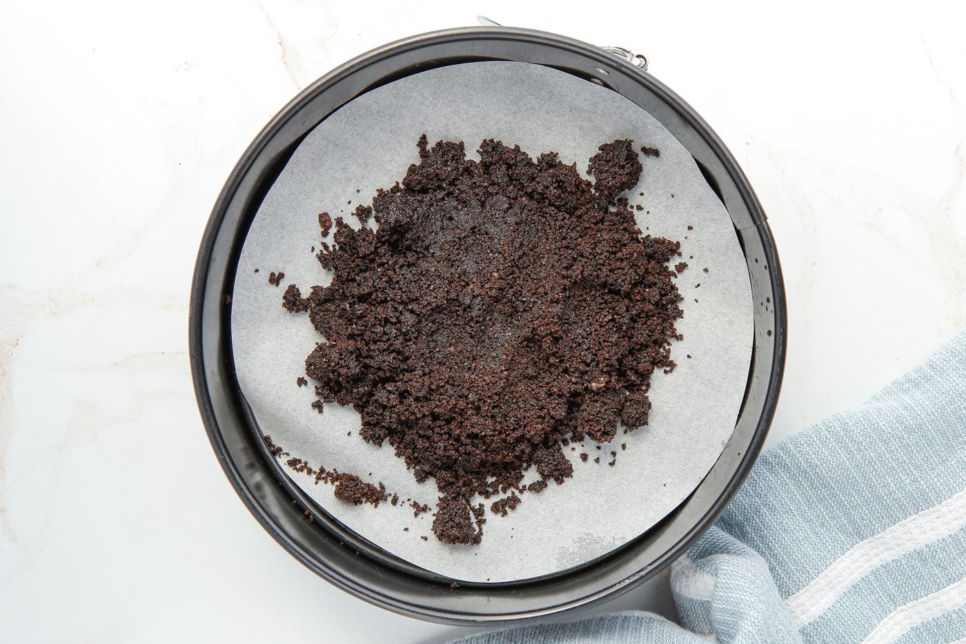 oreo crumbs in a springform pan
