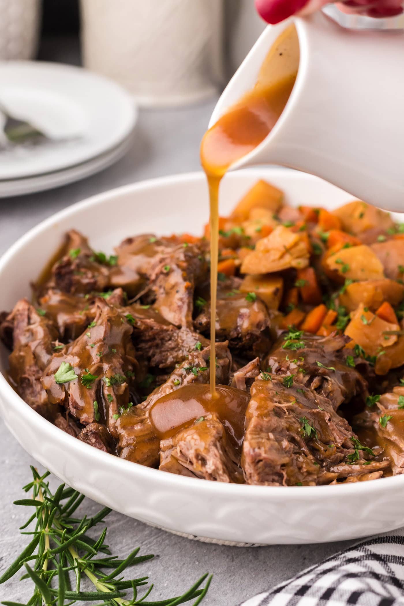 Gravy being poured over Instant Pot Roast Beef