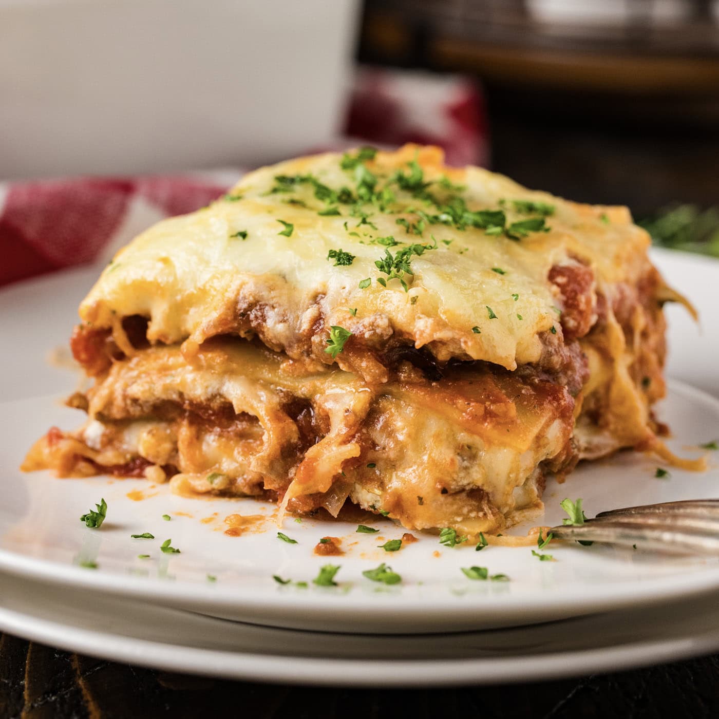 Close up photo of a serving of Italian Lasagna on a plate