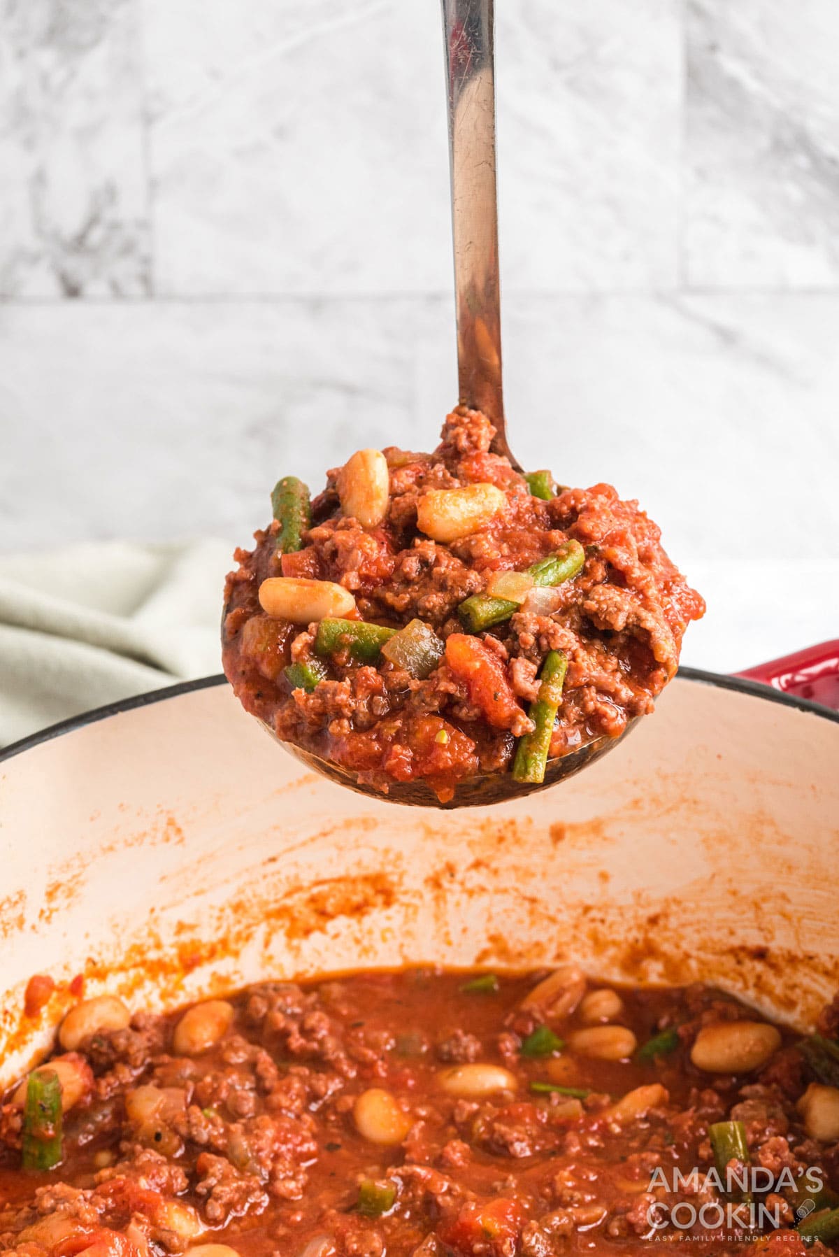ladle full of hamburger stew