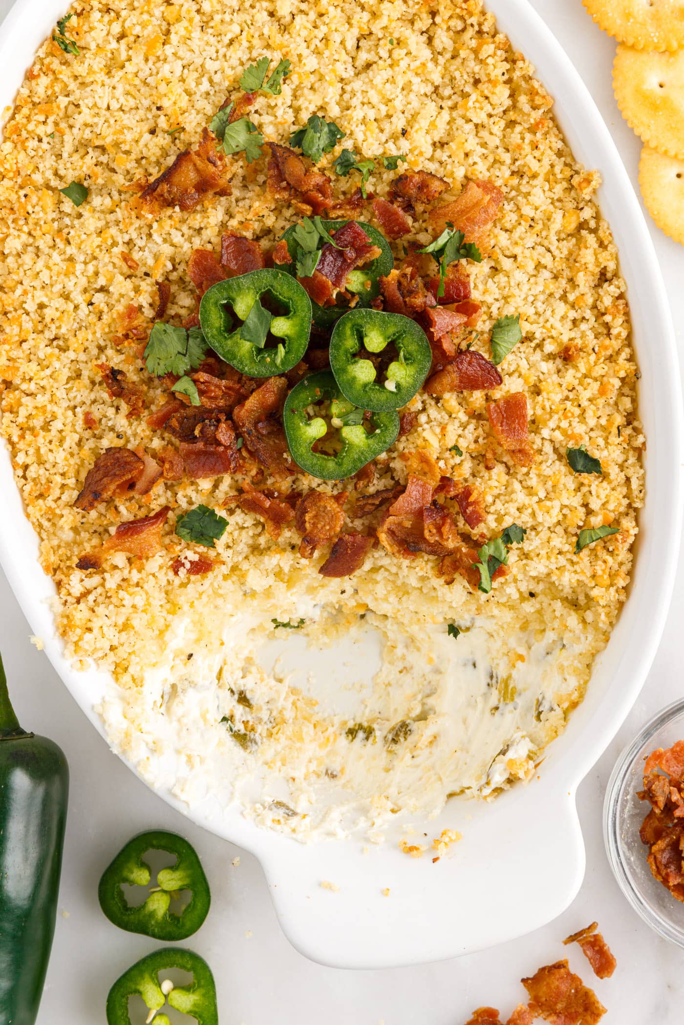 Jalapeno Popper Dip in a dish with some removed