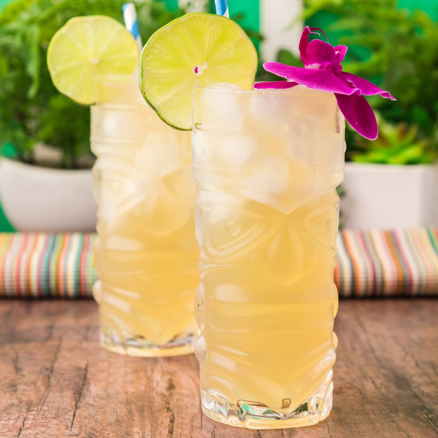 Two Jamaican Mules topped with a lime wheel and a flower