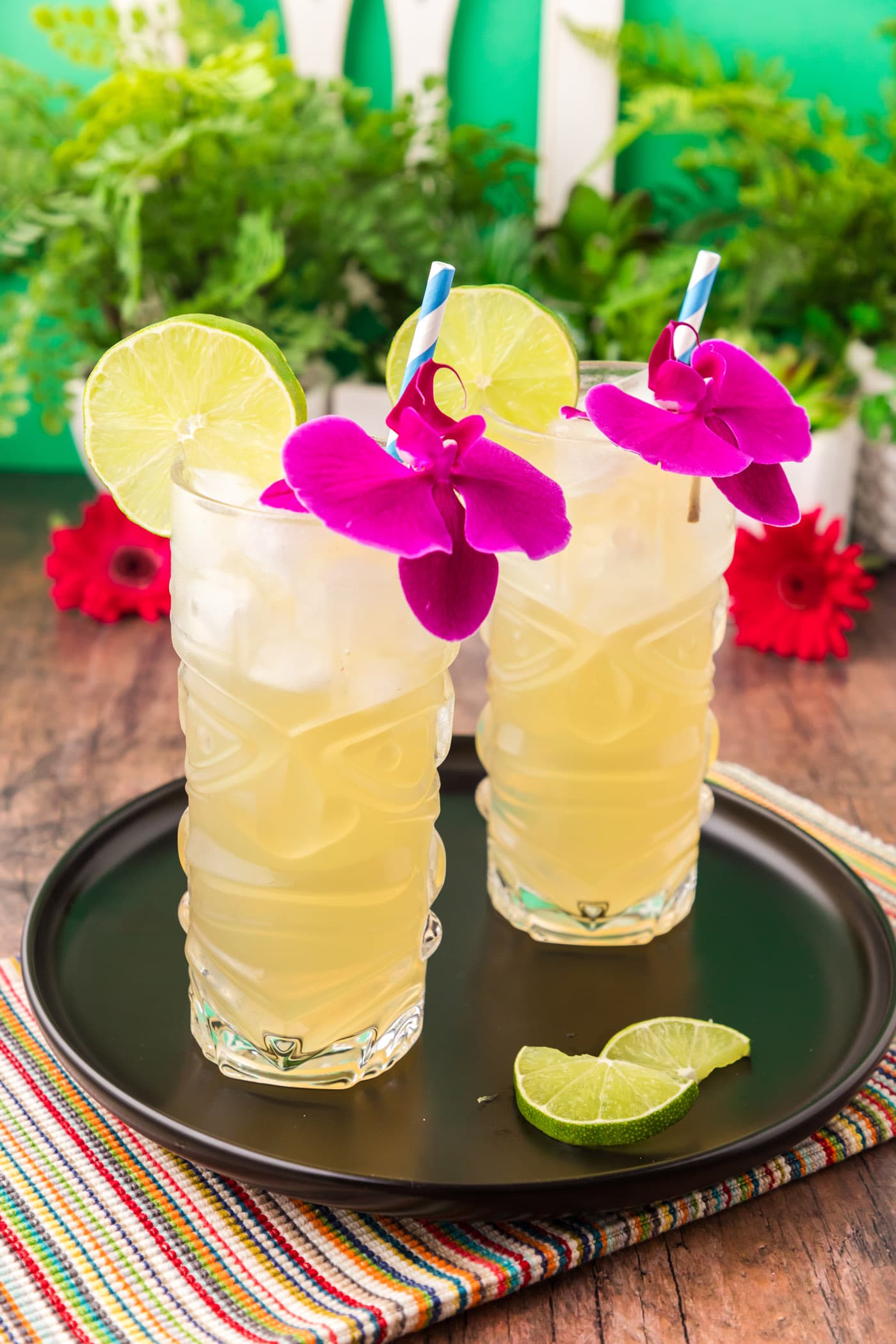 Two Jamaican Mules on a black tray with lime slices