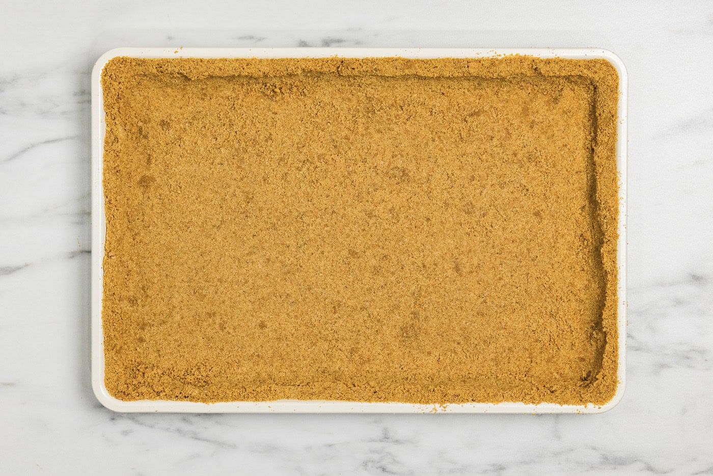graham cracker crust lined in a baking pan