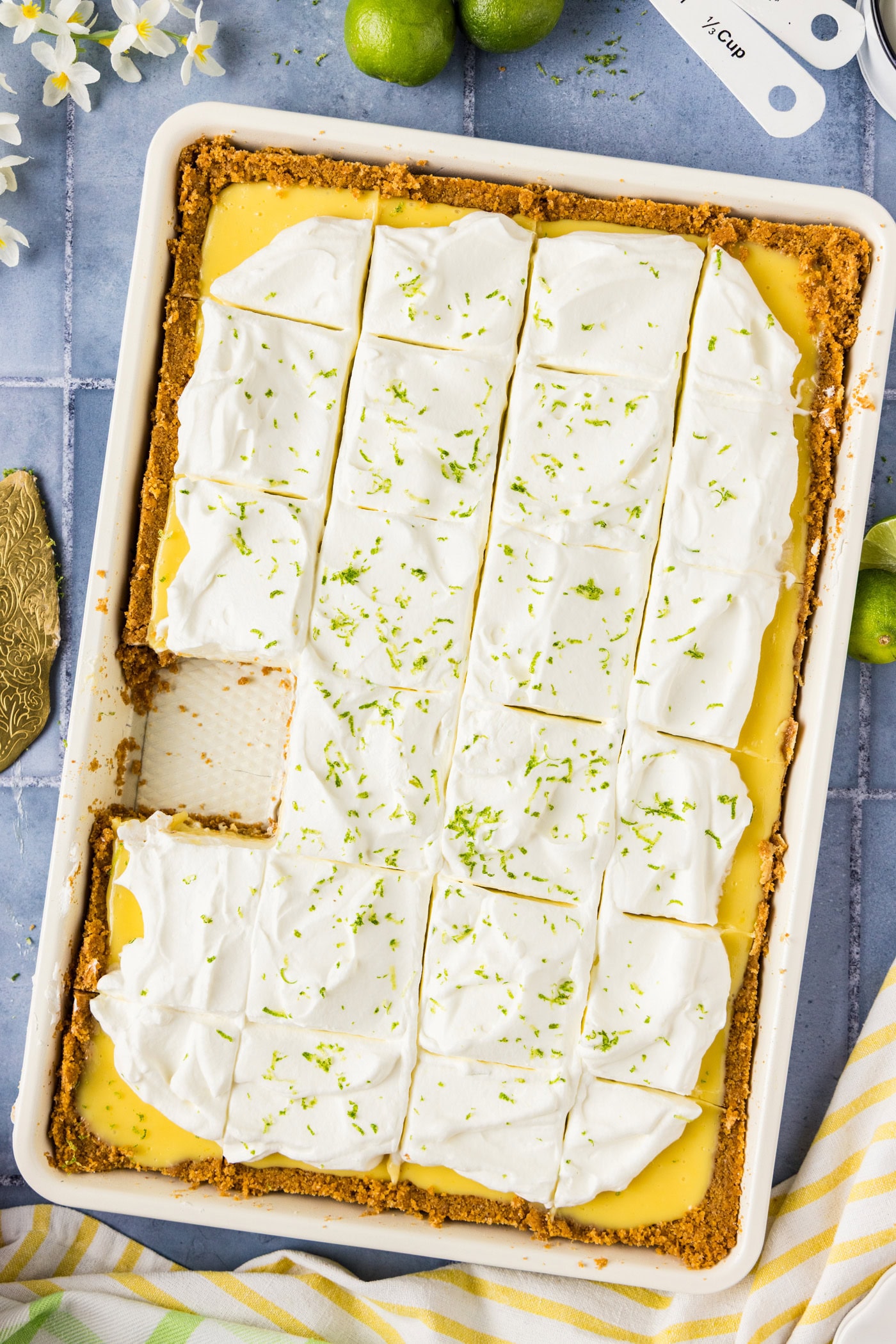 Key Lime Slab Pie cut into slices with a slice removed