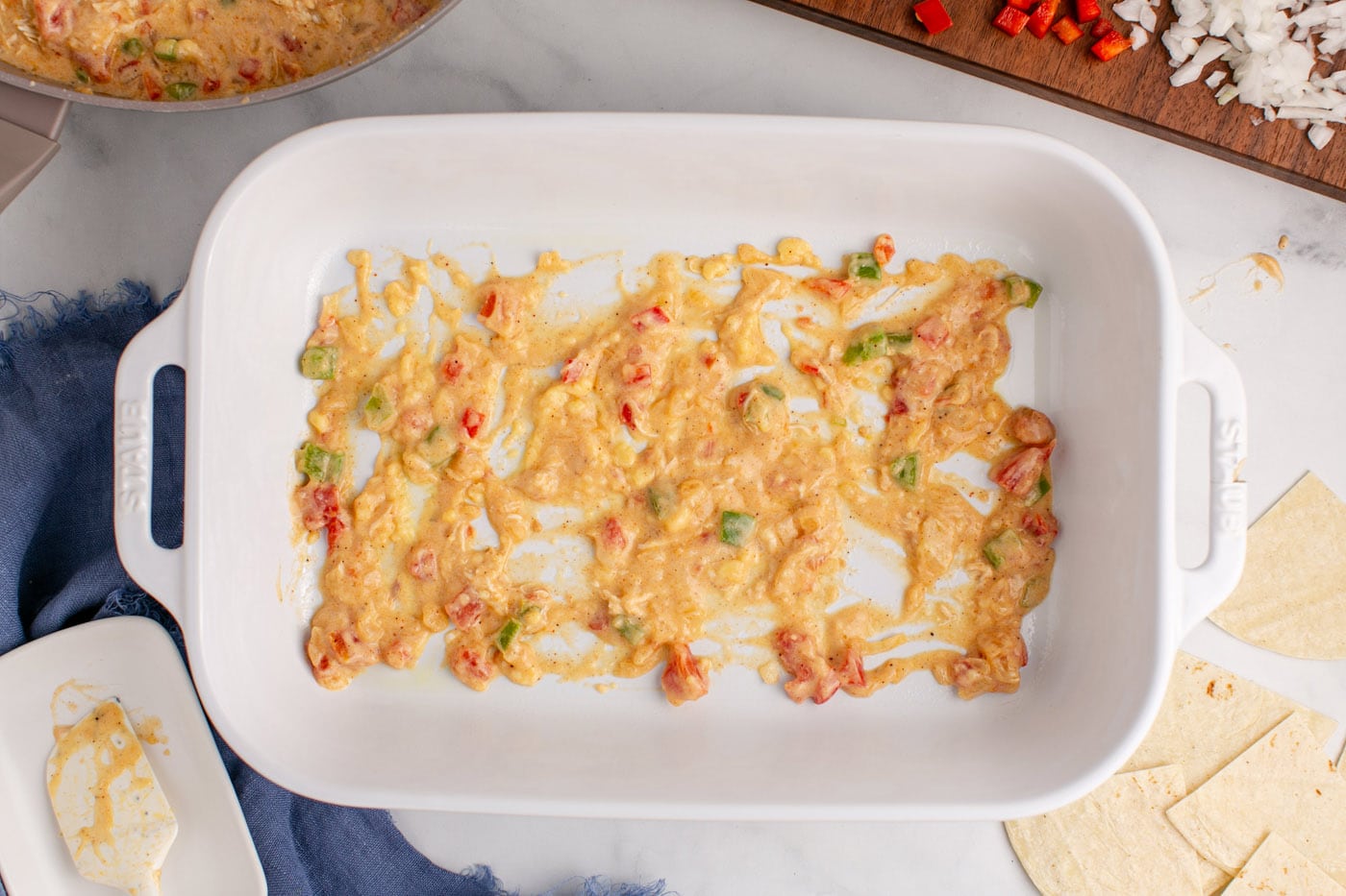 layer of sauce mixture on the bottom of a baking dish