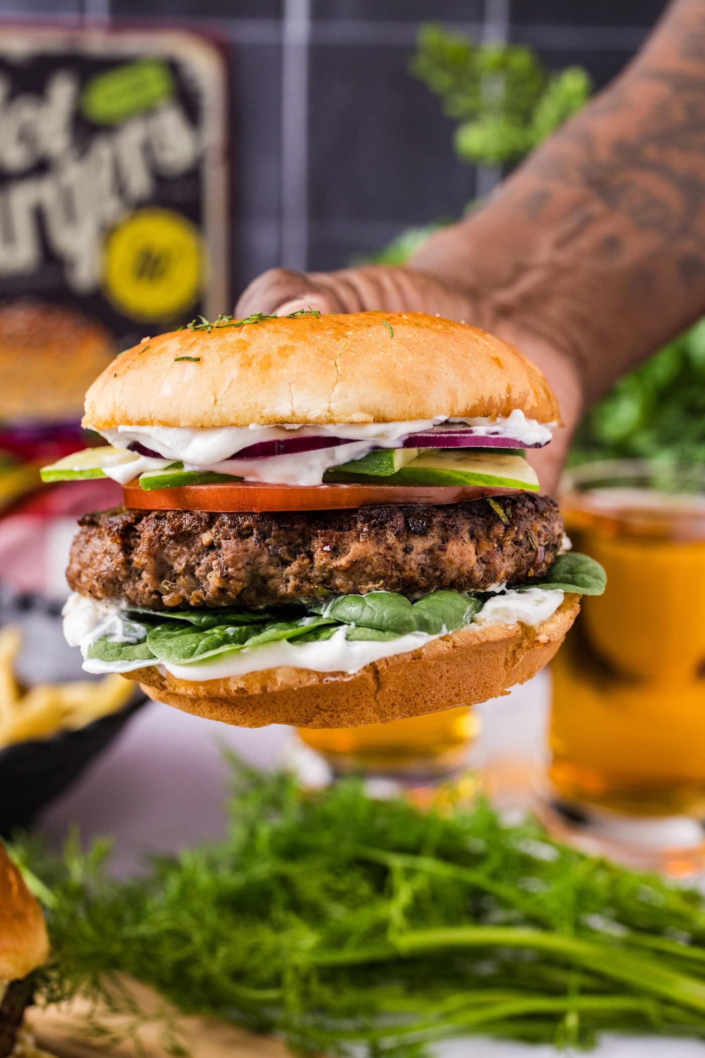 Hand holding a Lamb Burger