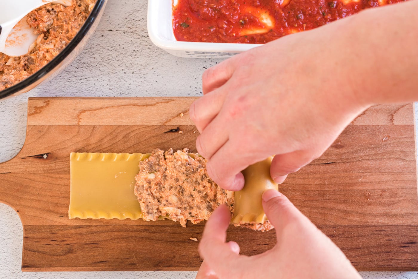 rolling lasagna noodle with filling
