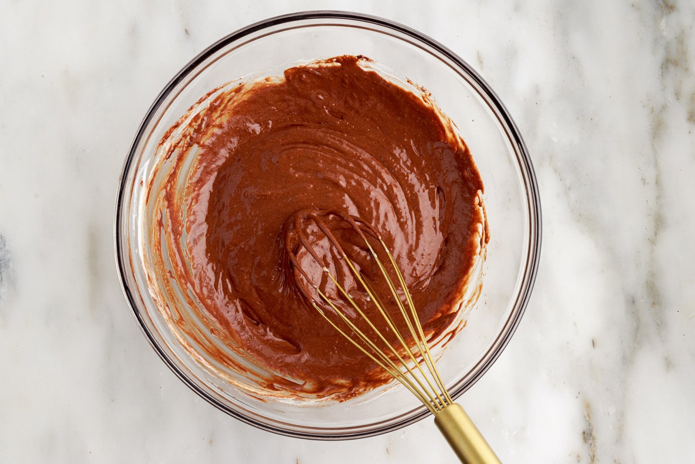 molten lava cake batter in a bowl with a whisk