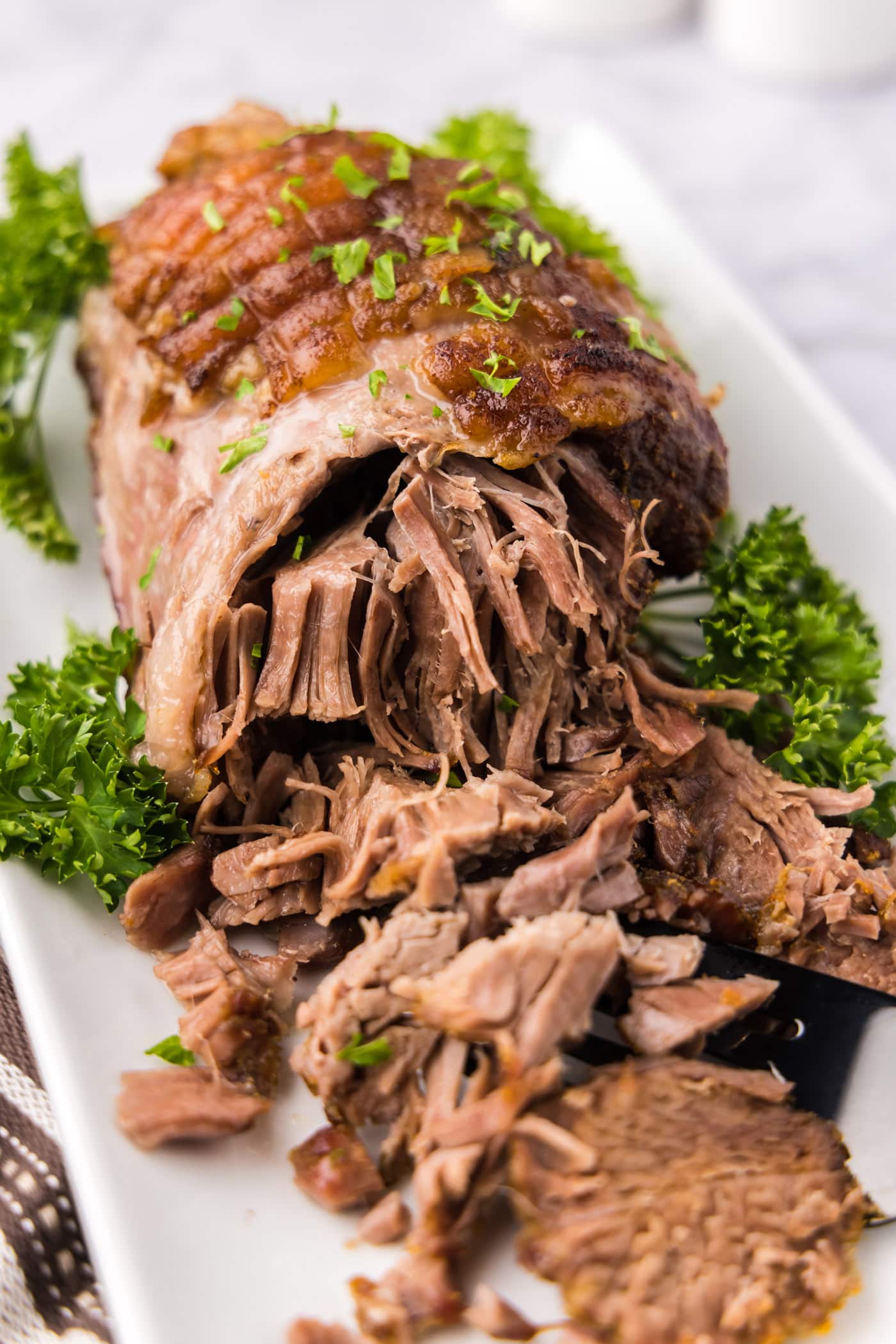 Close up photo of a Leg of Lamb on a platter