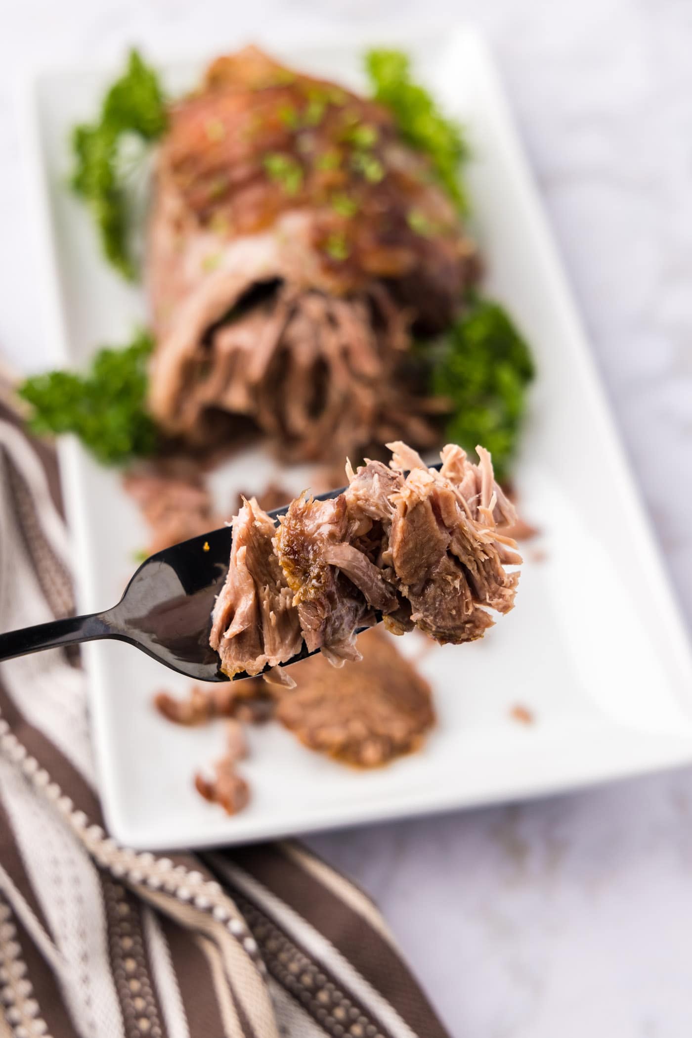 Pieces of Leg of Lamb on a fork