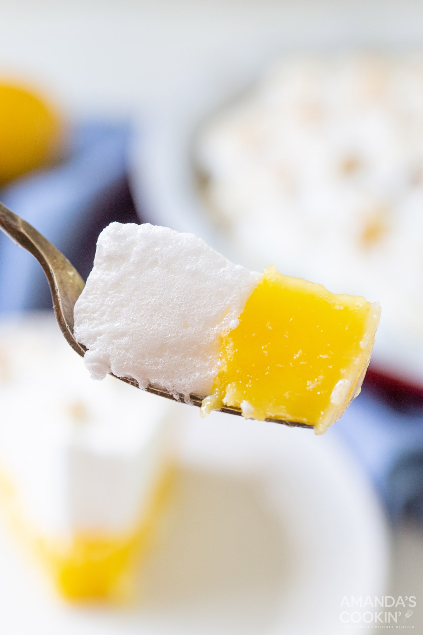fork full of lemon meringue pie