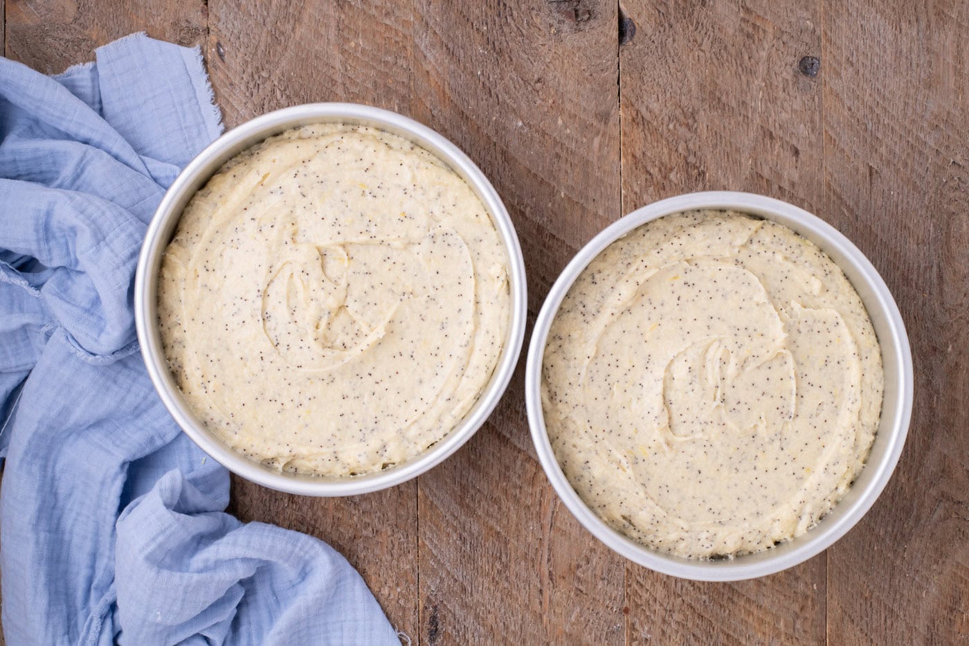 lemon poppy seed cake batter in cake pans