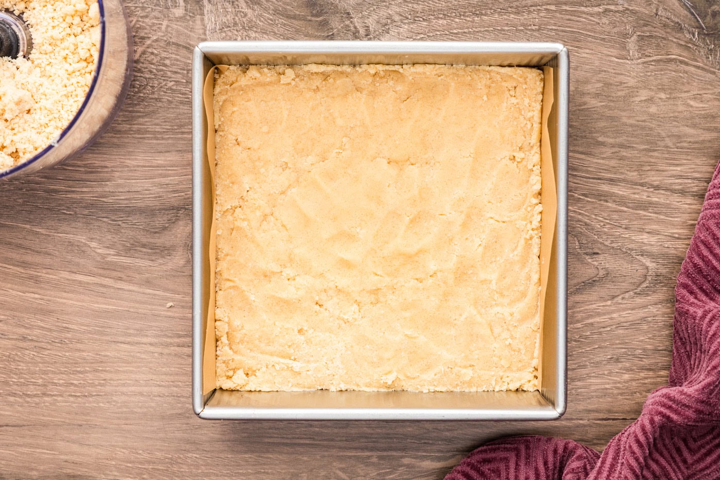 Crumb mixture pressed into a 9x9 pan