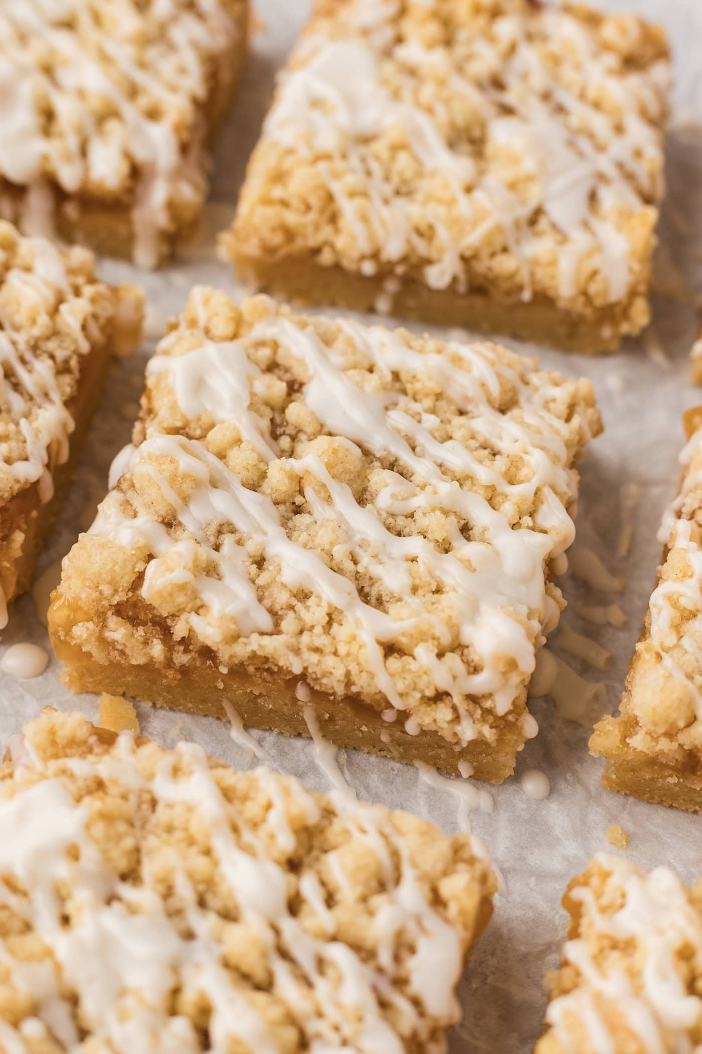 Close up photo of Lemon Streusel Squares on parchment paper
