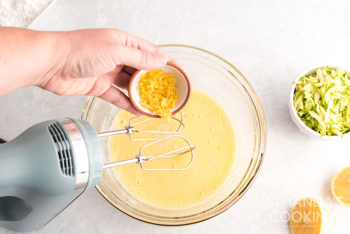 adding lemon zest to bowl