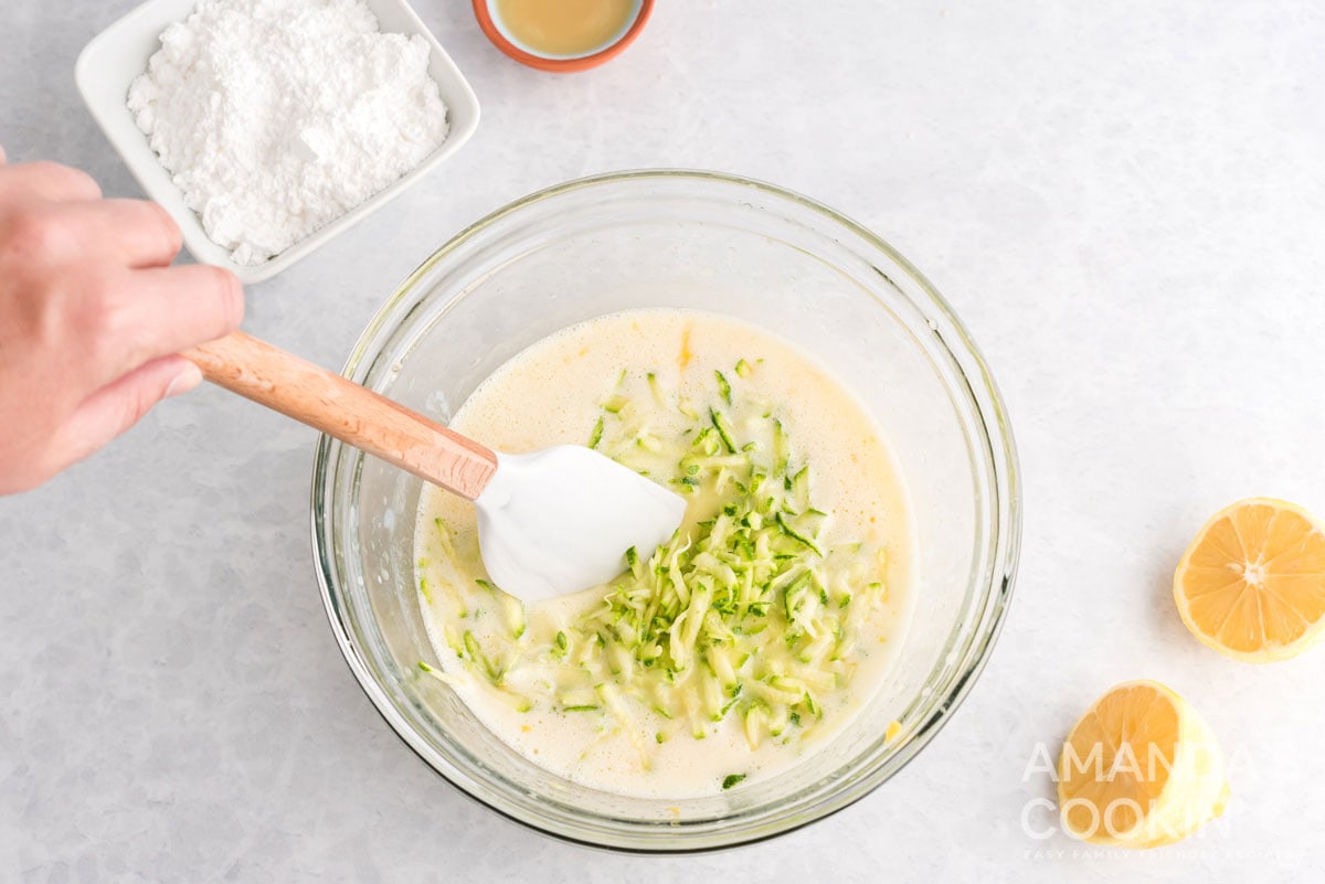 shredded zucchini in bowl of batter