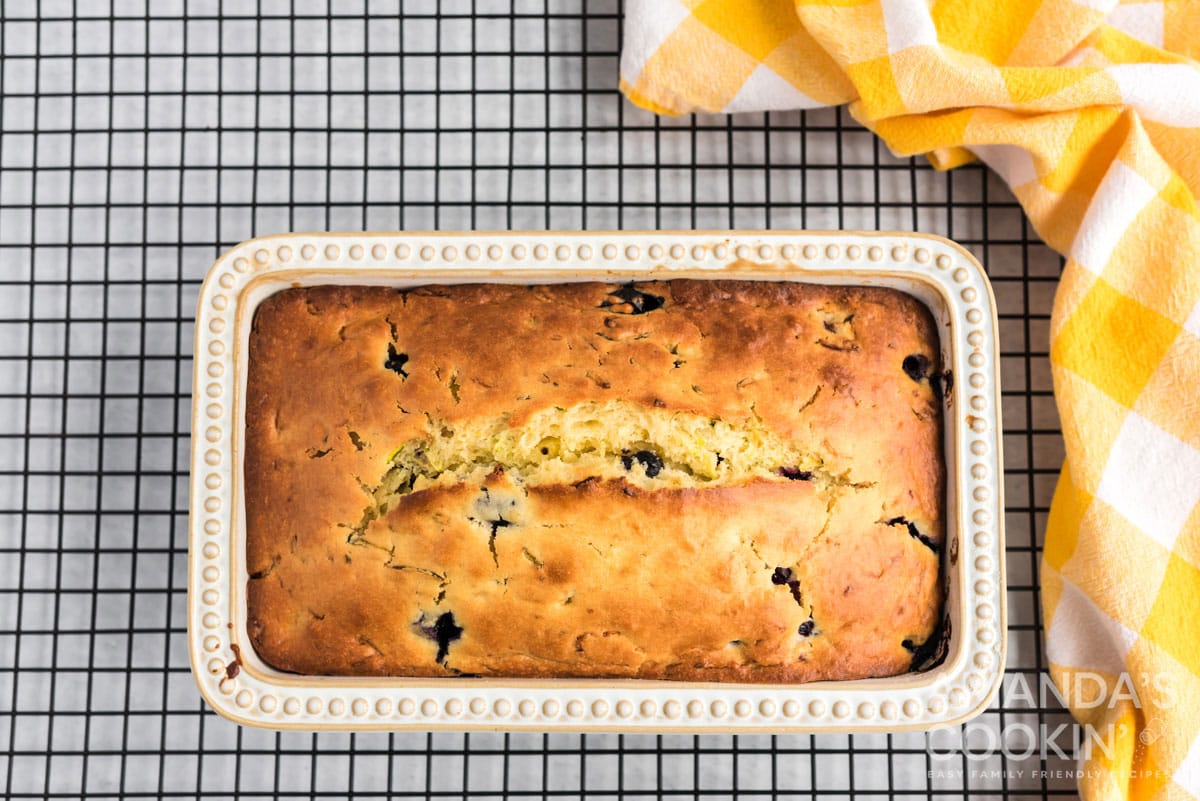 fully baked lemon zucchini bread in pan on wire rack