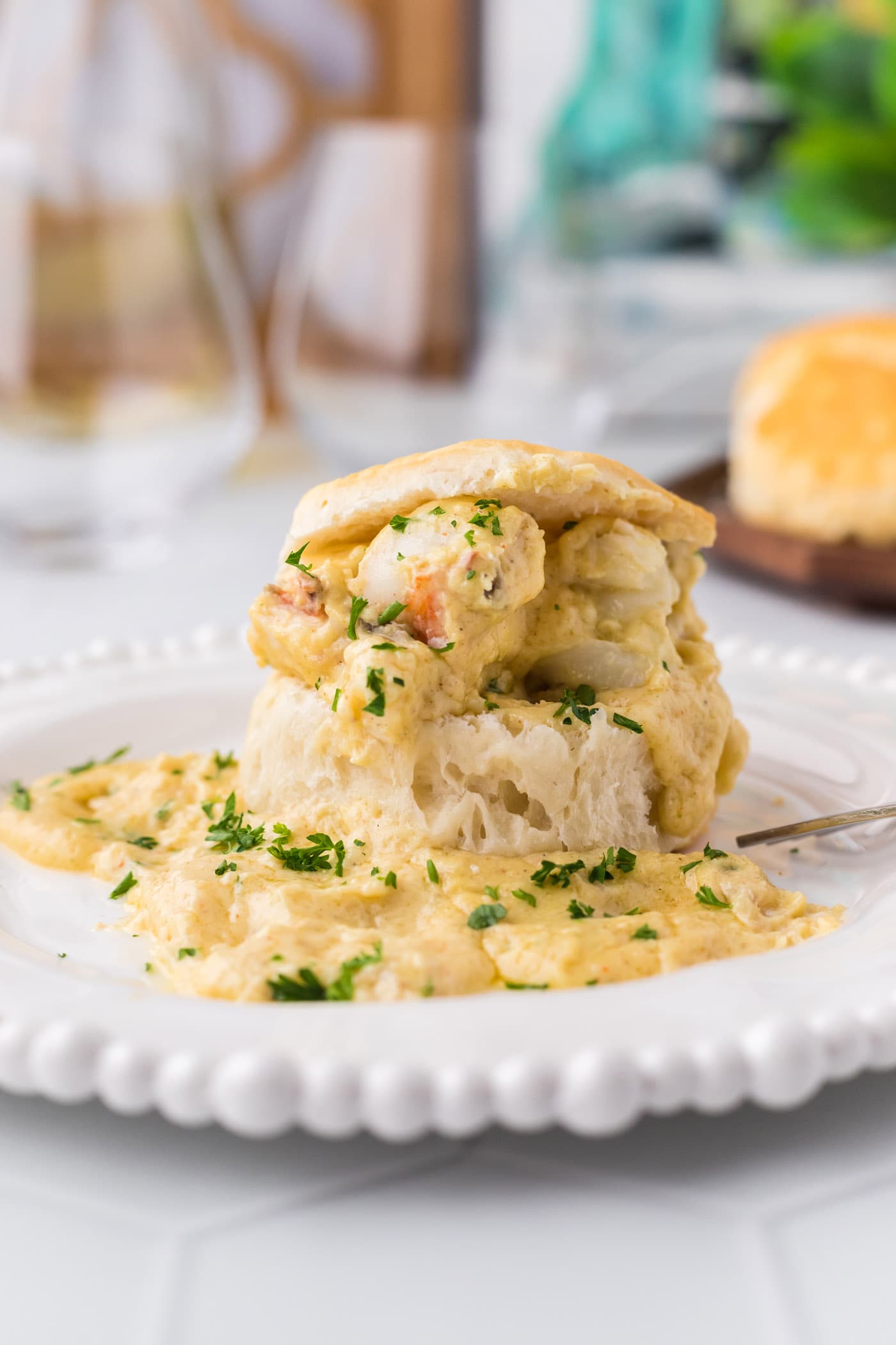 Lobster Newburg on an open biscuit