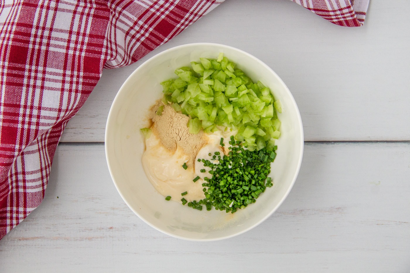 mayo lobster roll ingredients in a bowl