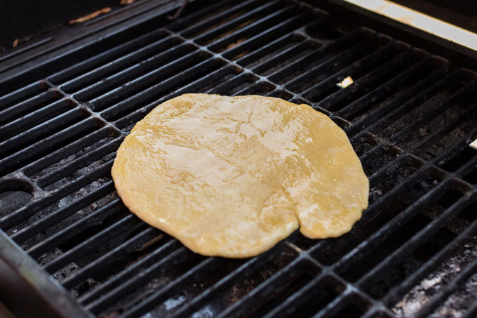 pizza dough on the grill