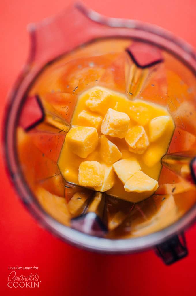 Frozen mangos in a blender