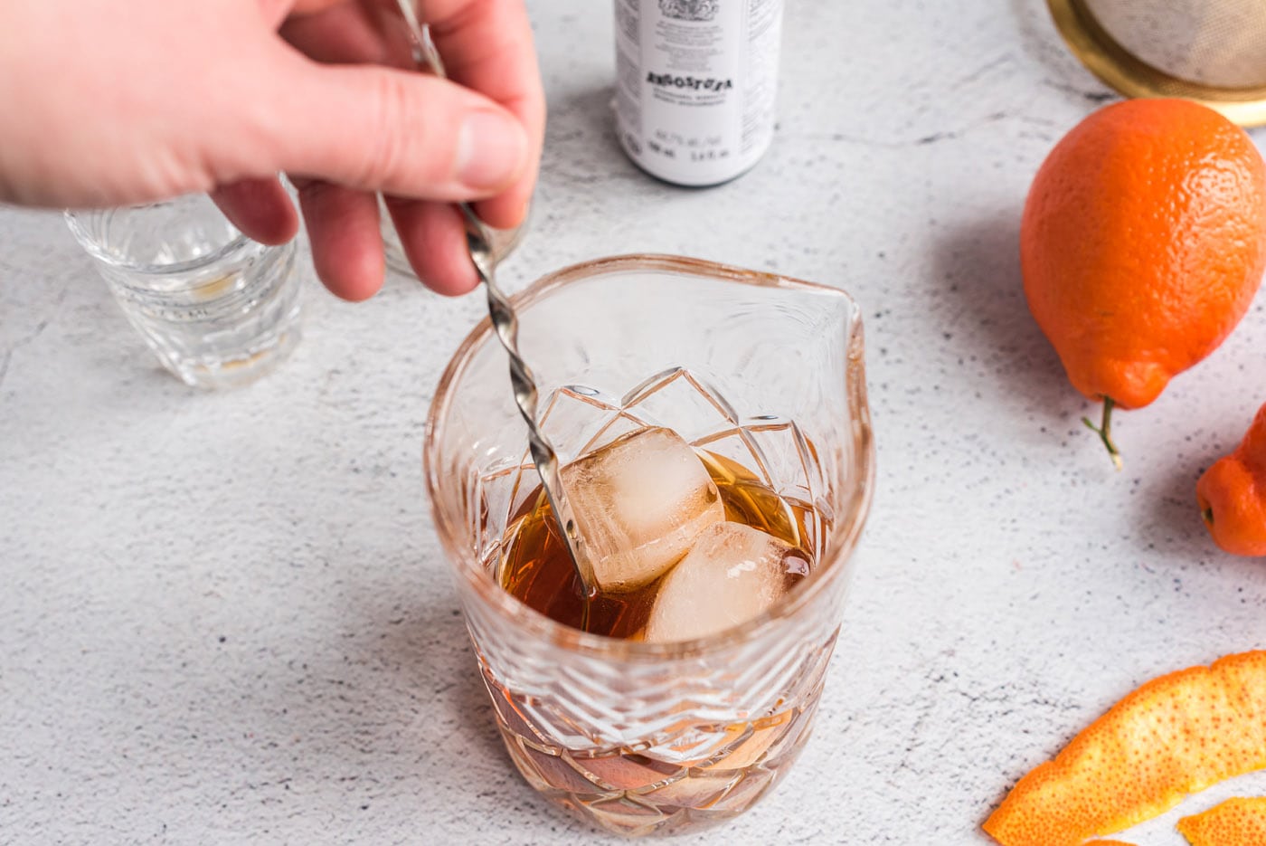 stirring manhattan cocktail with ice