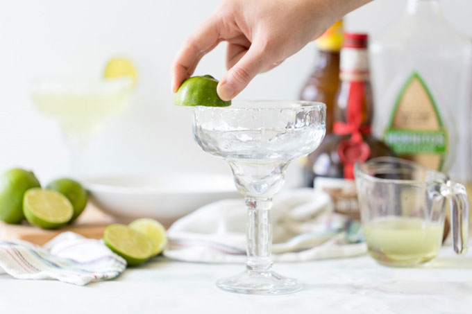 rubbing lime on a glass rim