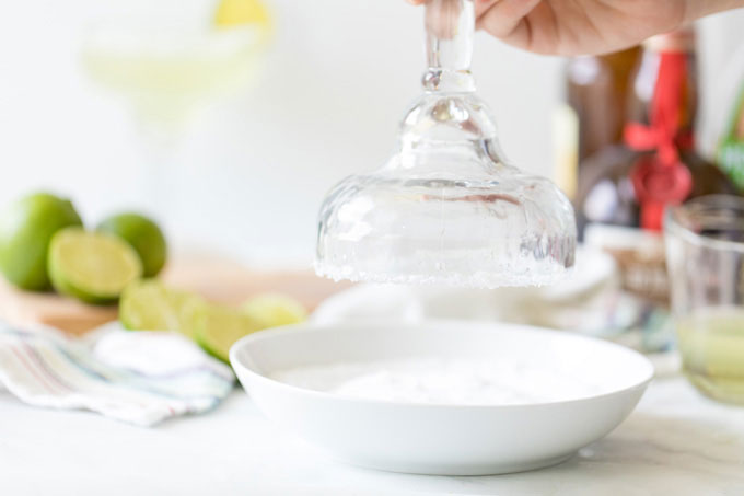 dipping rim of glass into salt