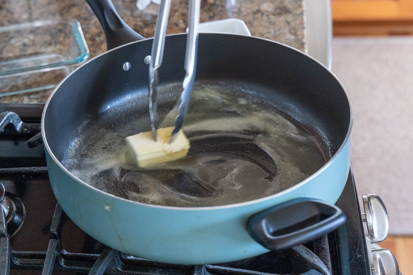 melting butter in a hot skillet