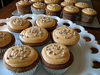 A close up photo of Mexican chocolate cupcakes with dulce de leche frosting.