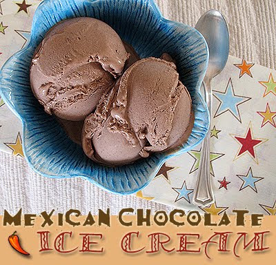 Mexican chocolate ice cream in a blue bowl with a spoon on the side.