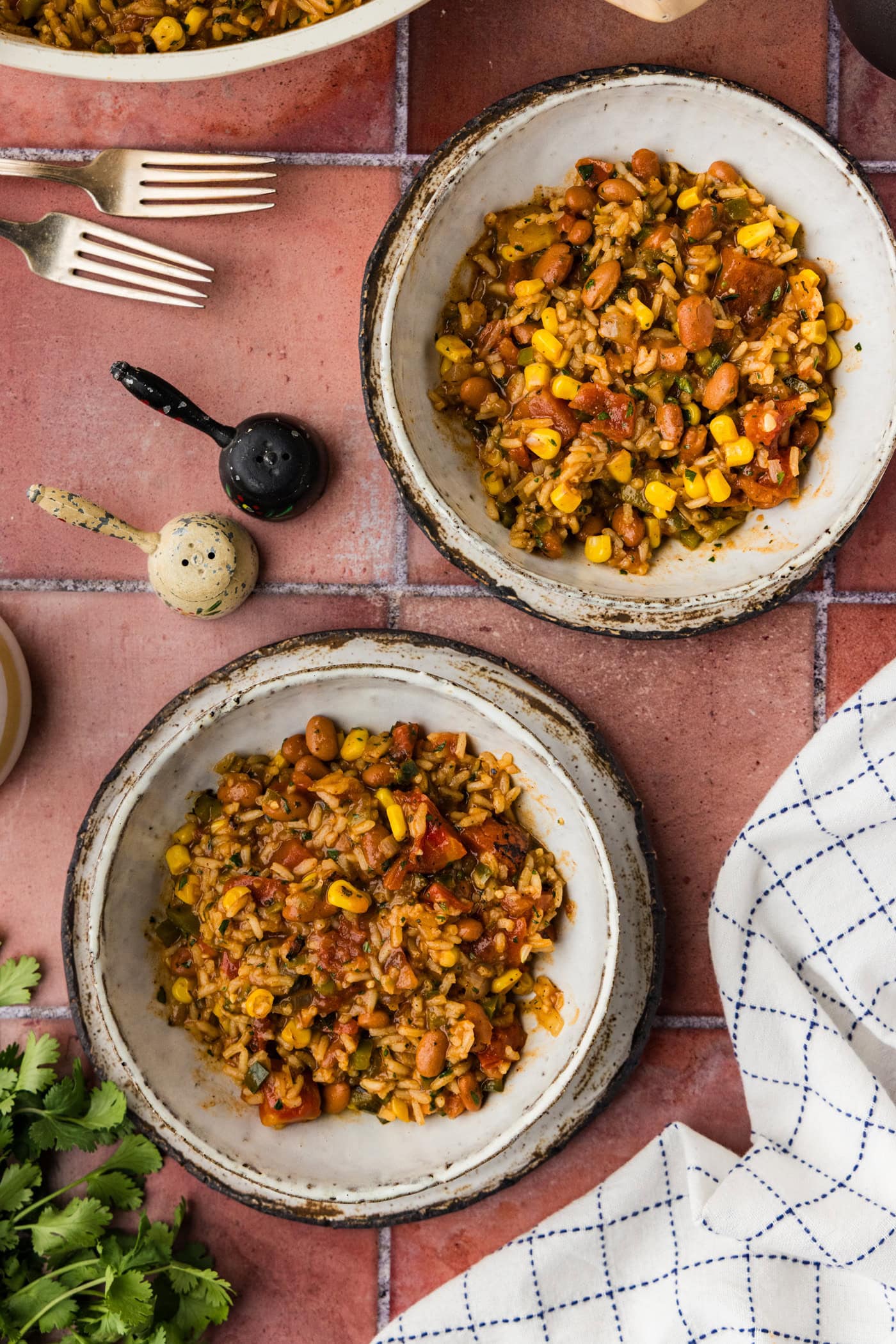 Delicious Mexican rice and beans served in rustic bowls, perfect for a flavorful, hearty meal.