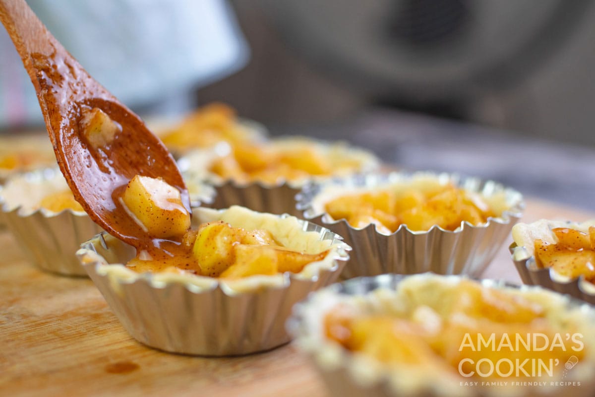 adding filling to pie dough