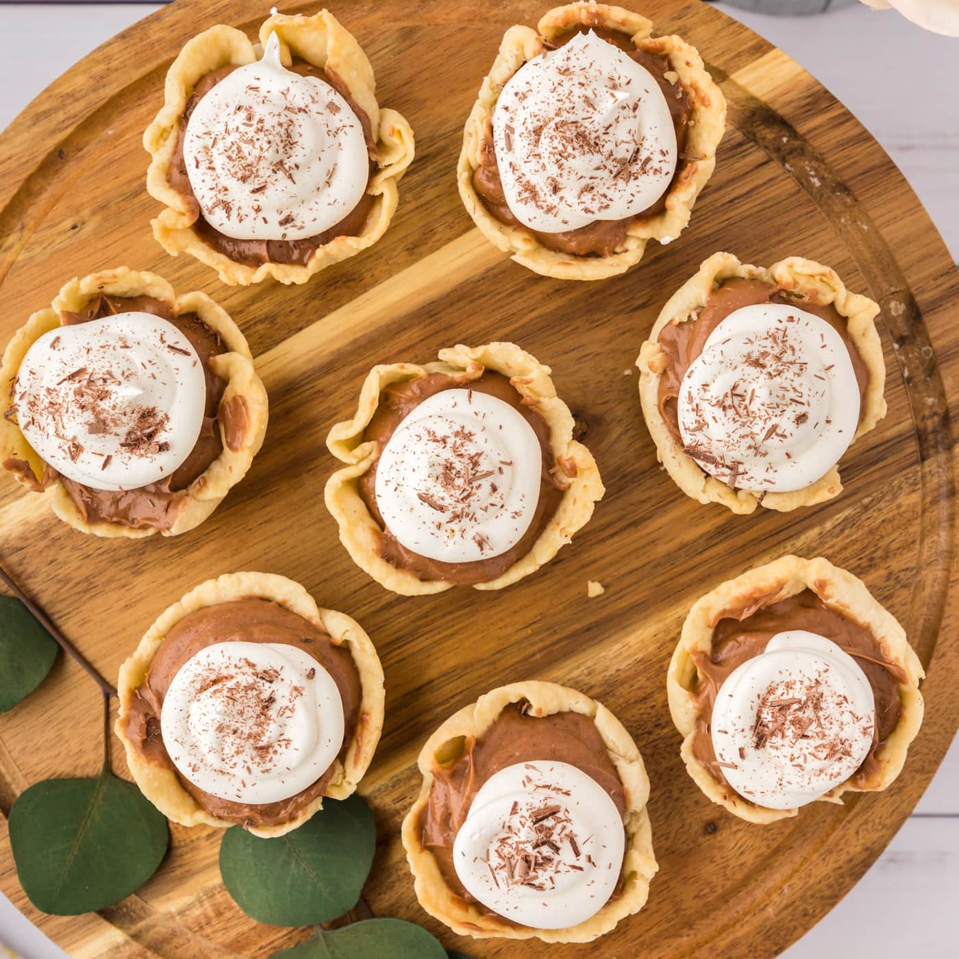 Mini French Silk Pies on a wooden platter