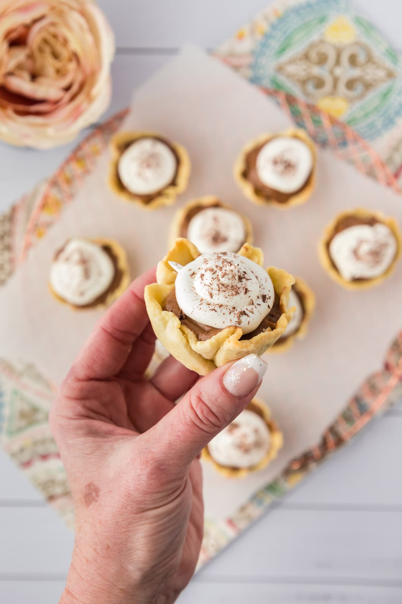 Hand holding a Mini French Silk Pie