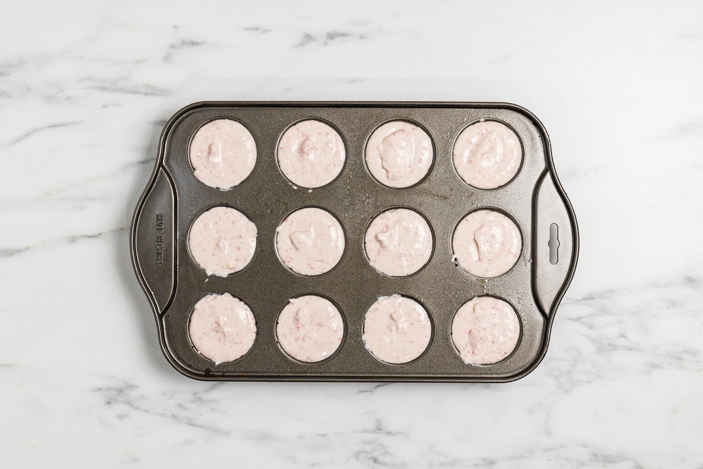 mini strawberry cheesecakes in a pan