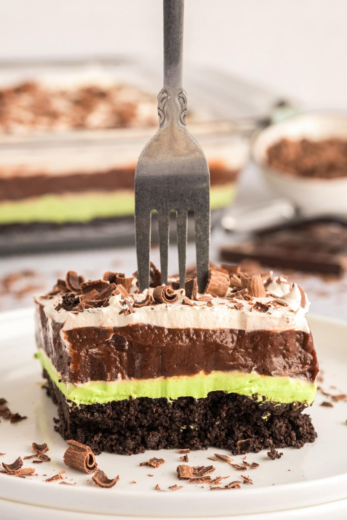 Fork stuck in a slice of Mint Chocolate Lasagna