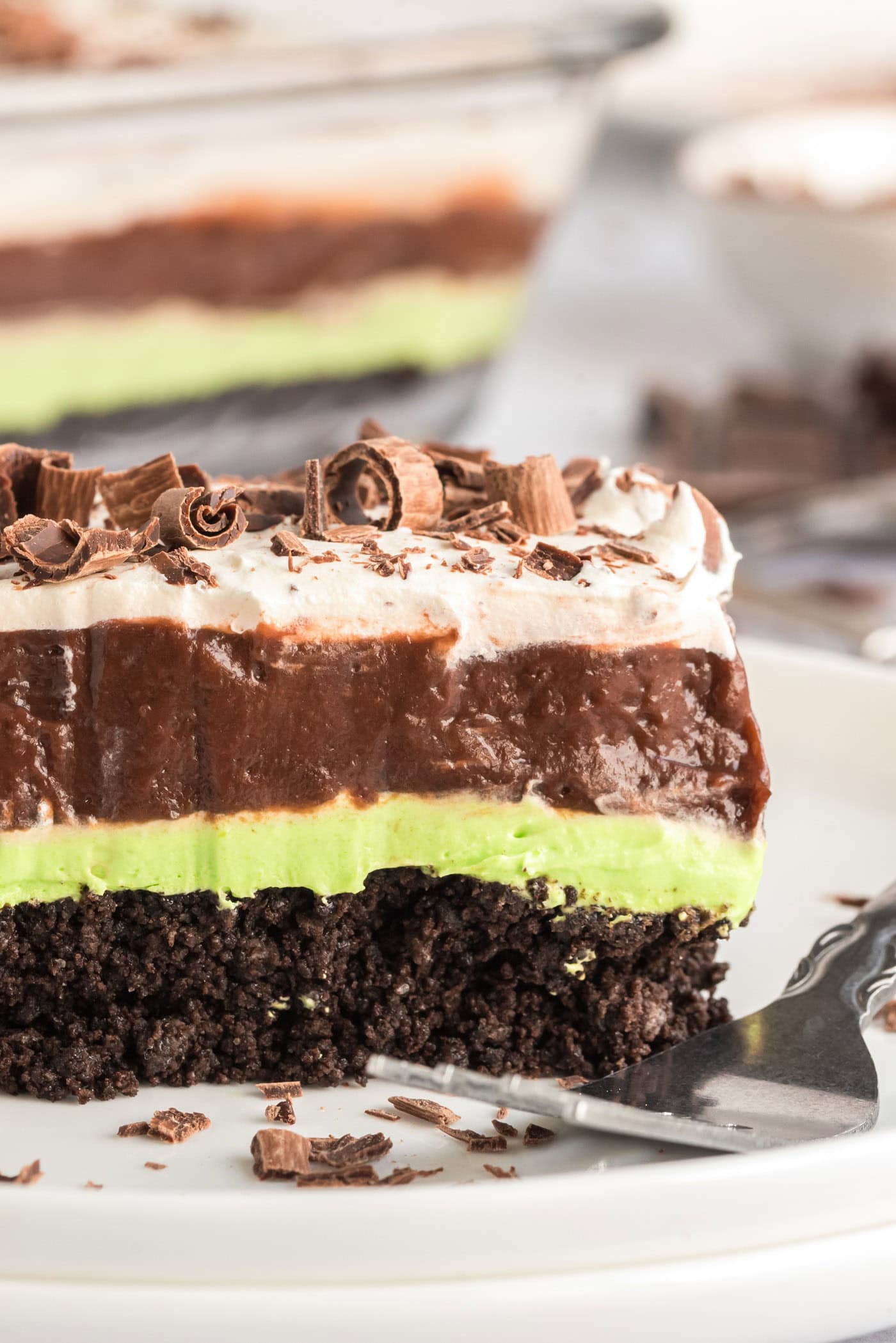 Close up photo of a slice of Mint Chocolate Lasagna