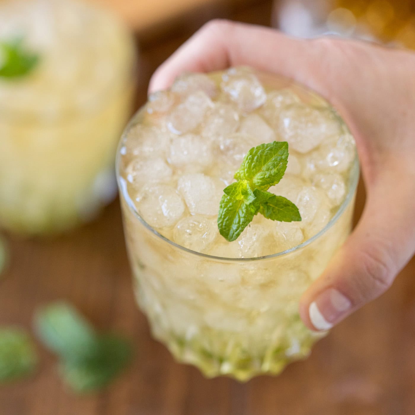 hand holding a mint julep