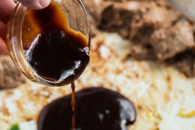 adding sauce to skillet