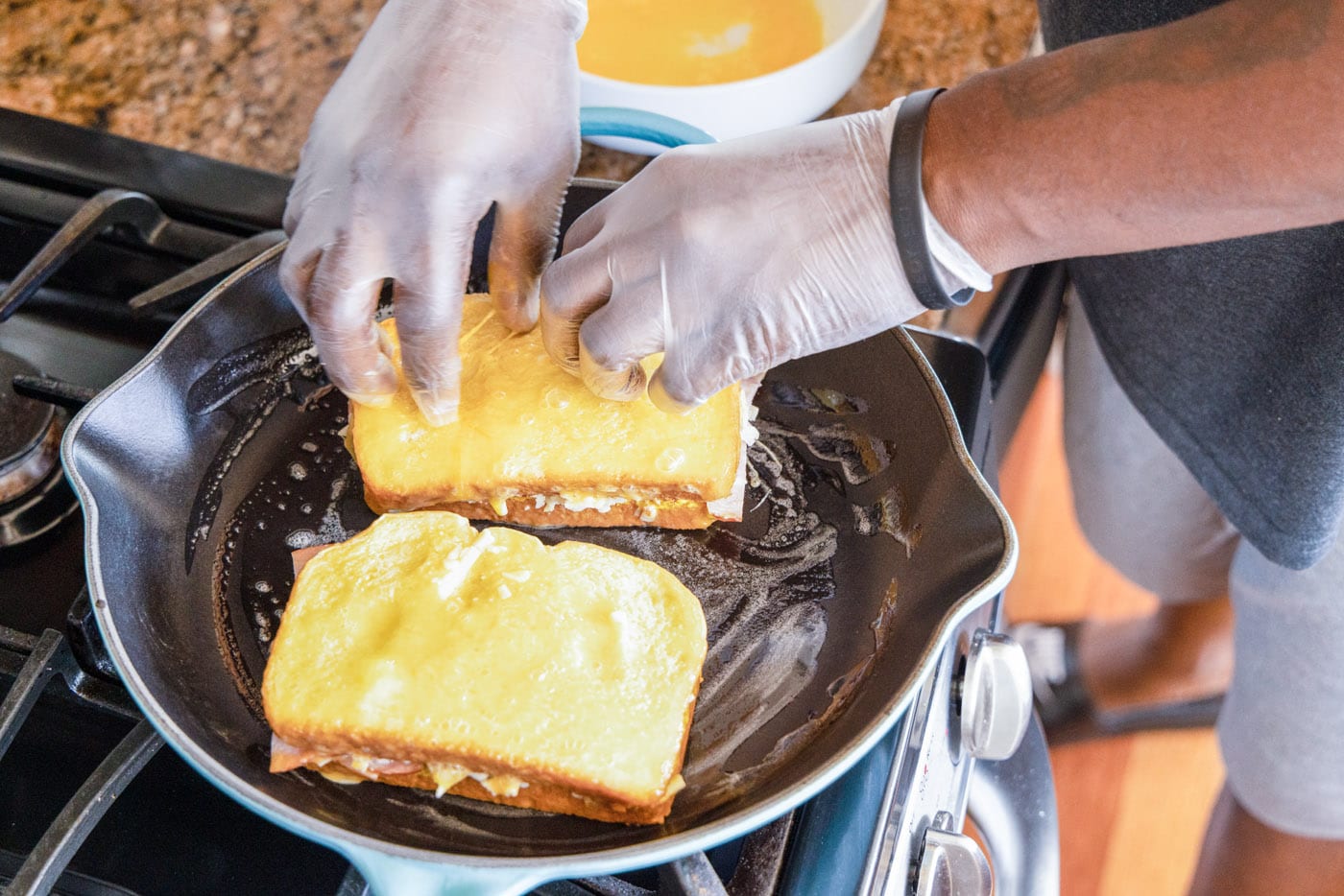 frying monte cristo sandwich in skillet with butter