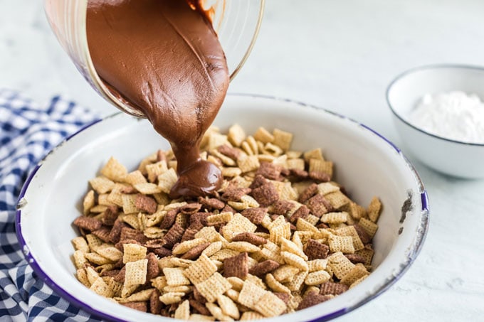 pouring chocolate into chex cereal
