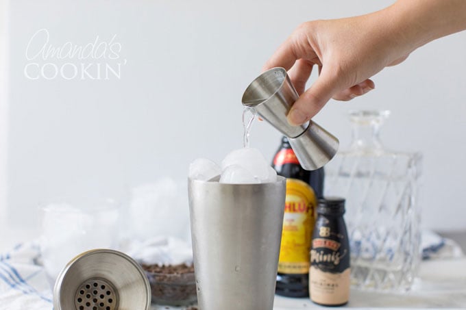 pouring vodka into cocktail shaker