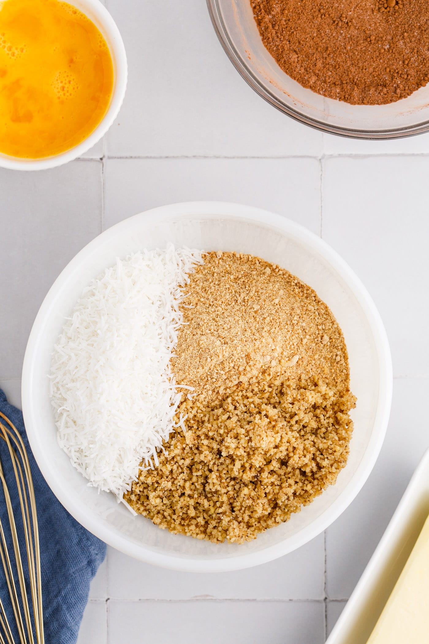 coconut, graham, and walnuts in a bowl