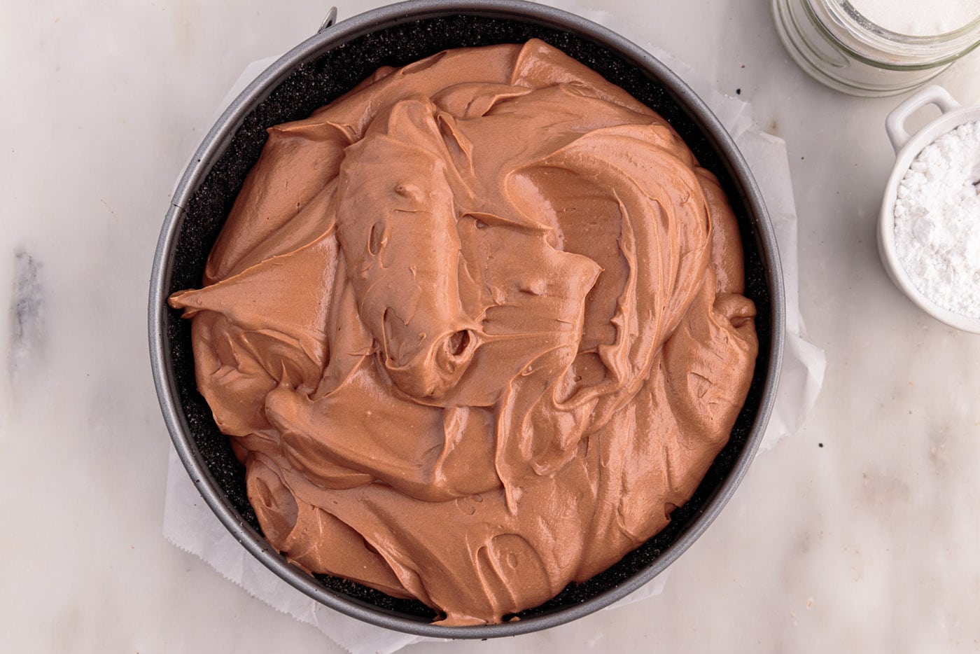 chocolate cheesecake mixture in a springform pan