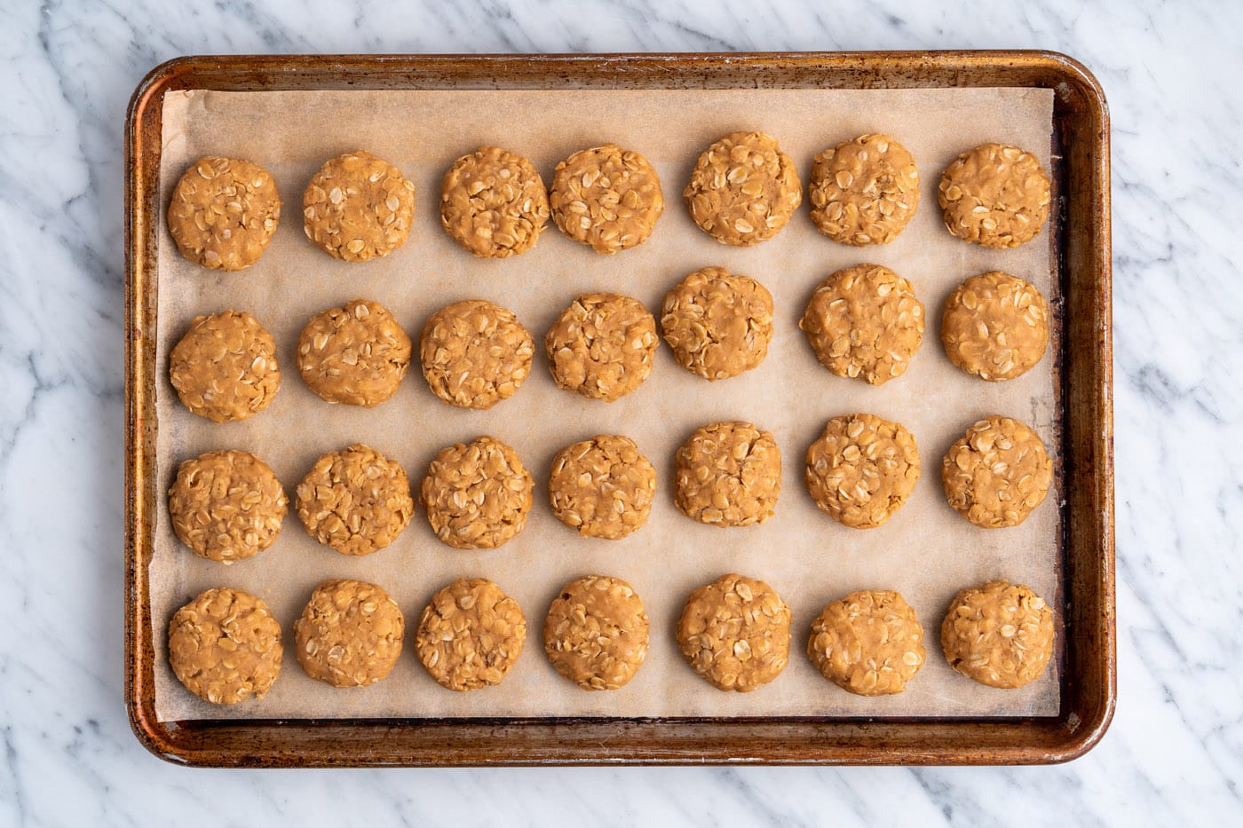 no bake peanut butter cookies on a baking sheet resting